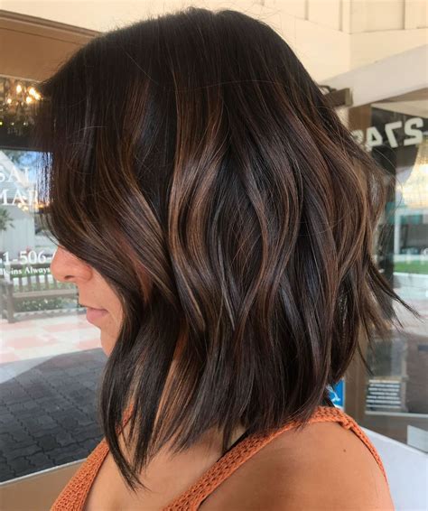30. Cinnamon Balayage Bob. The balayage highlights in this lovely color, reminiscent of cinnamon, are incredibly flattering, especially for women with short brown hair. Blow dry your strands in different directions to create this messy textured look. Save.